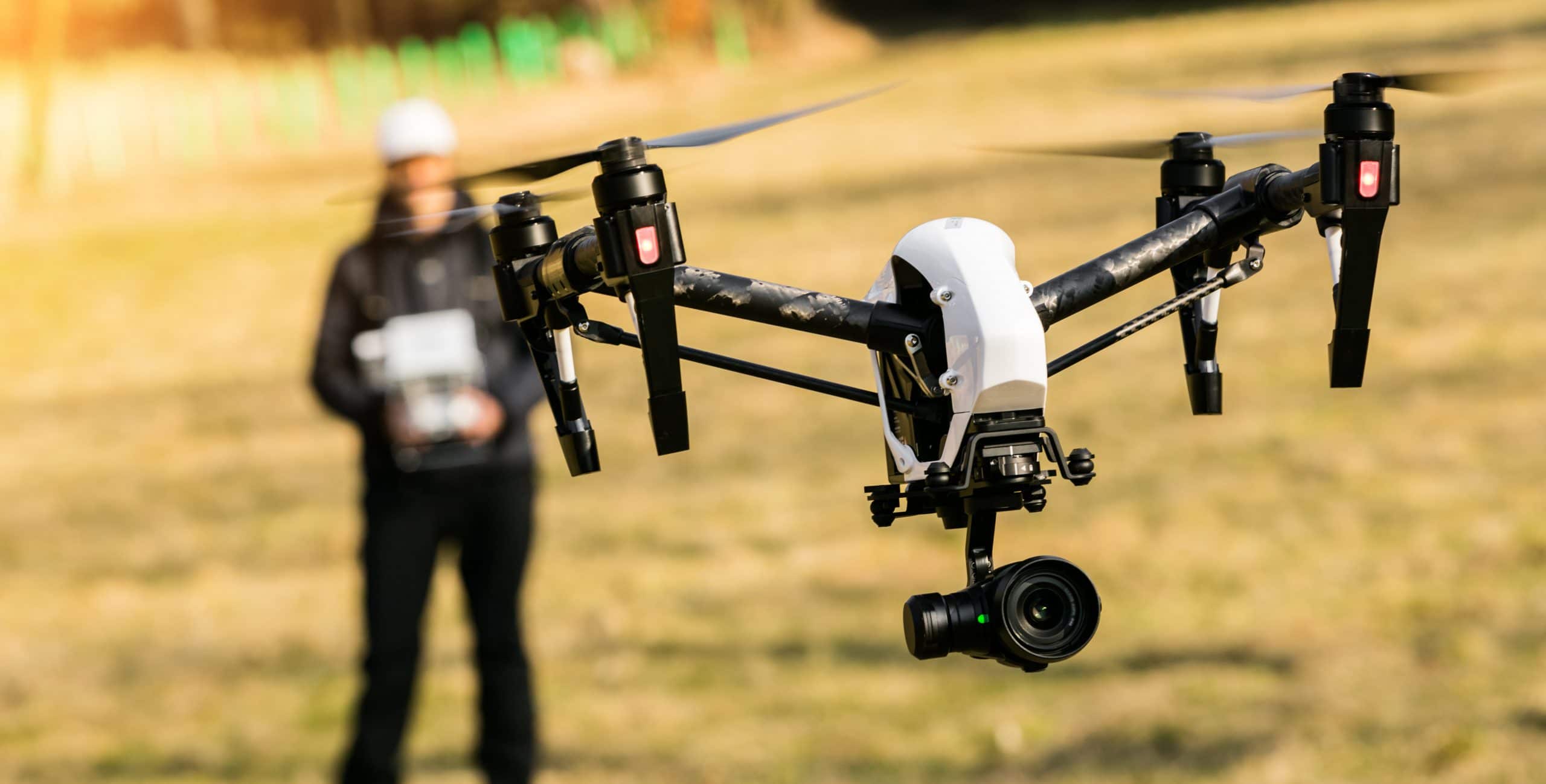 Man handling drone in nature